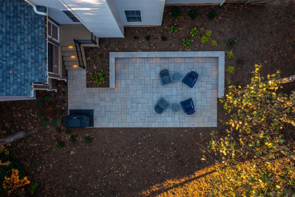 Aerial view of Banyon Tree patio with four patio chairs and two coffee tables.