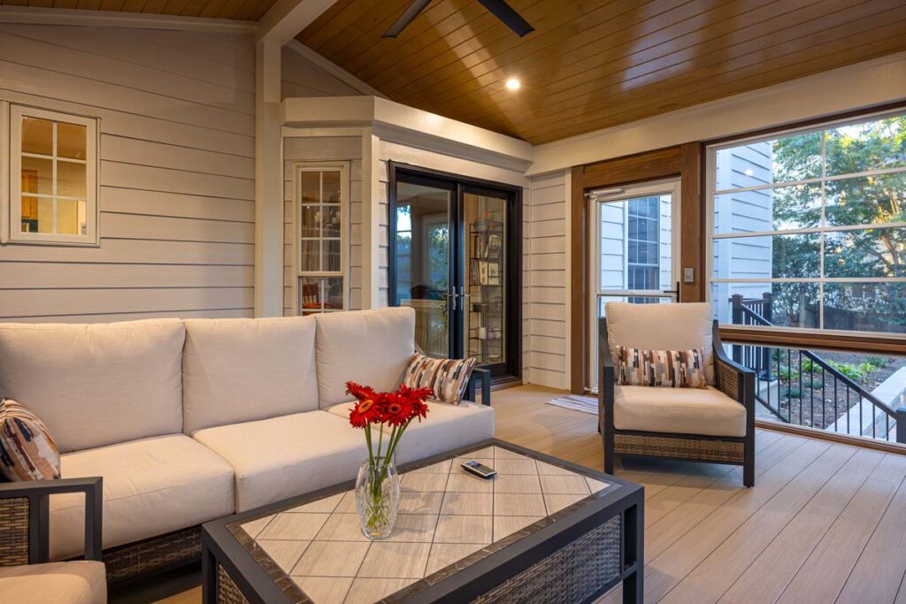 Interior of Banyon Tree deck showing couch and two individual chairs.