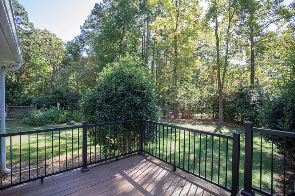 Exterior close up of composite deck of the Coachmans Way project, looking toward the backyard.