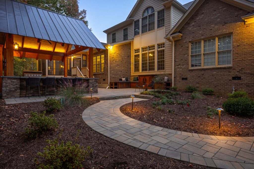 Side view of Colvard Park in the evening showcasing pavilion and walkway.