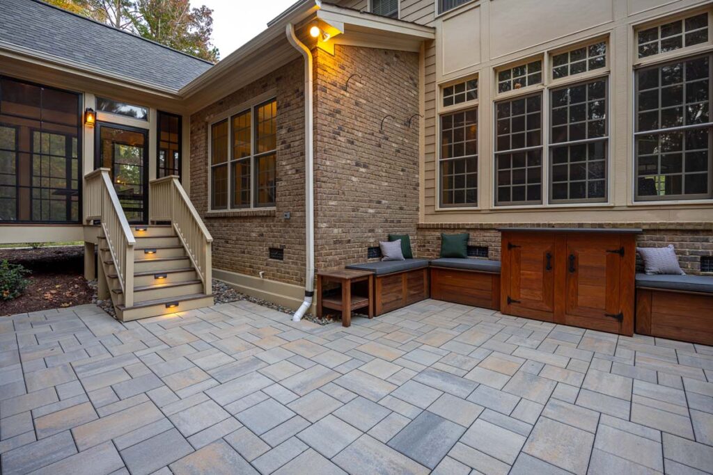 Corner view of Colvard Park patio area with deck on the left and a corner with sitting area and storage.