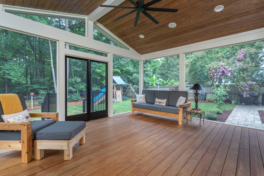 Three-quarter angle view of Jasper screen deck showing patio door on the right and walkway.