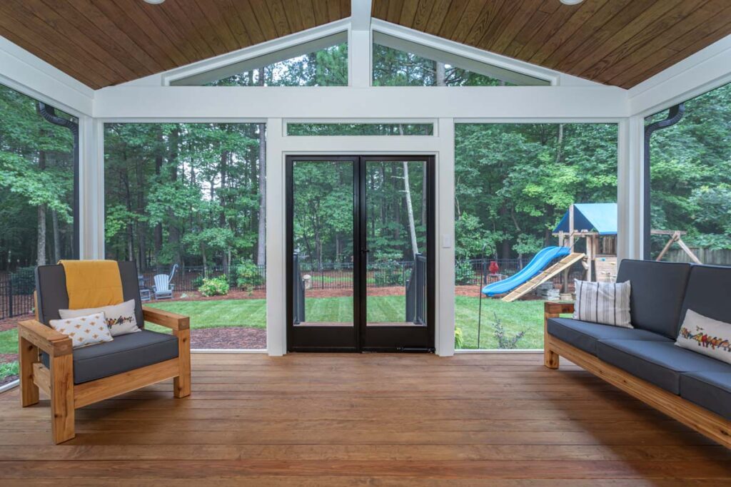 Interior wide shot of Jasper screen deck, facing towards backyard and patio door in the center.