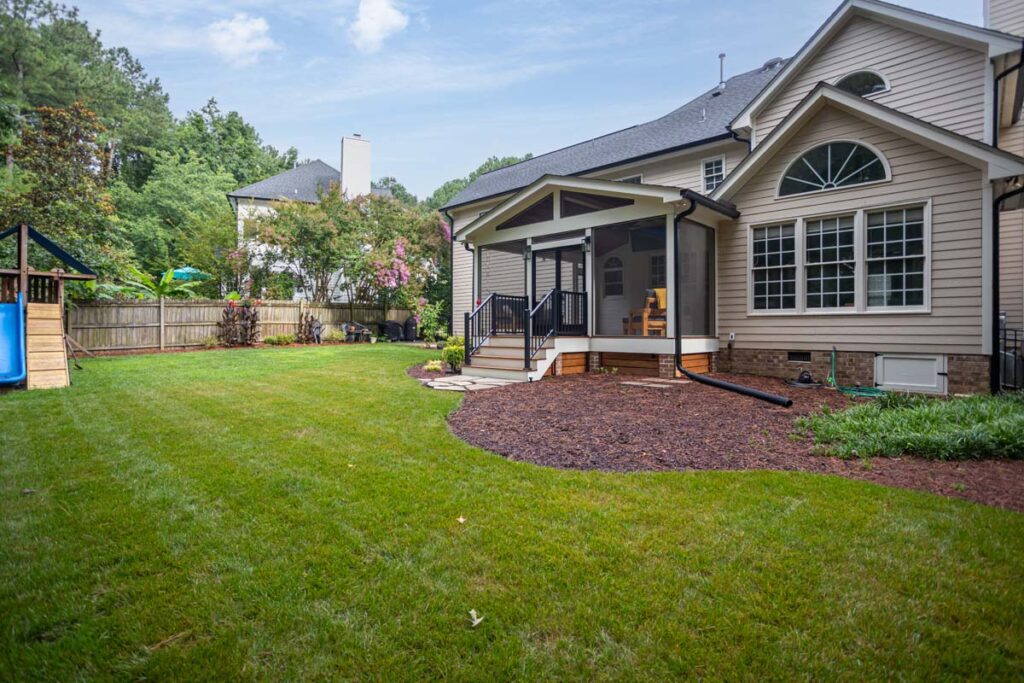 Wide shot of Jasper backyard with screened deck.