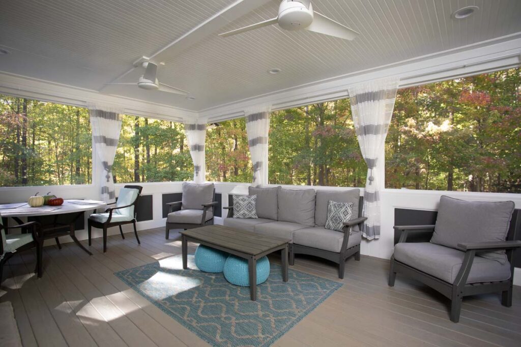 Wide shot of interior deck, Northlake project, a dining table, sofa and coffee table.