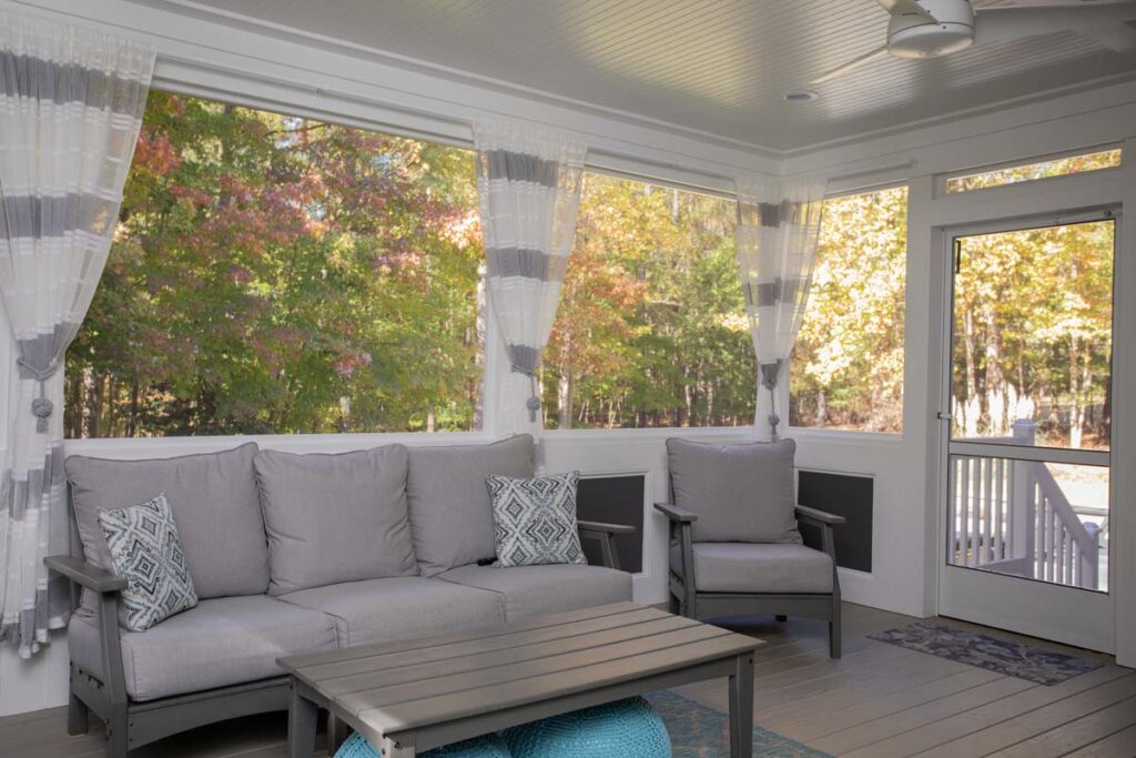 Interior deck of the Northlake project, showing sofa and patio door leading outside.