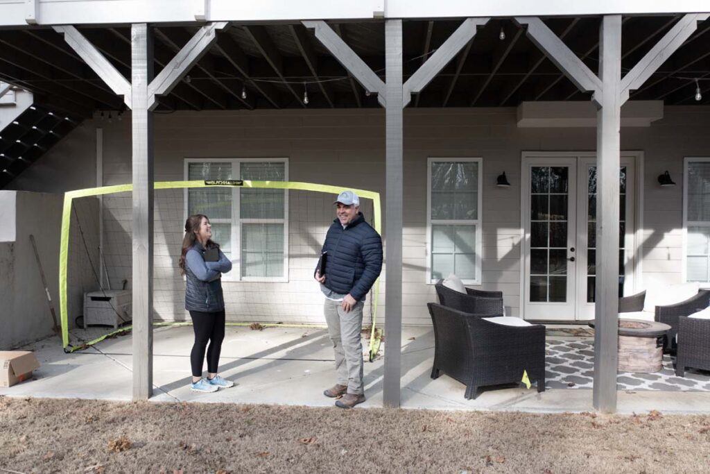 Front view of Roseroot deck with Randy Scott and Abbie Tilley planning upcoming project.