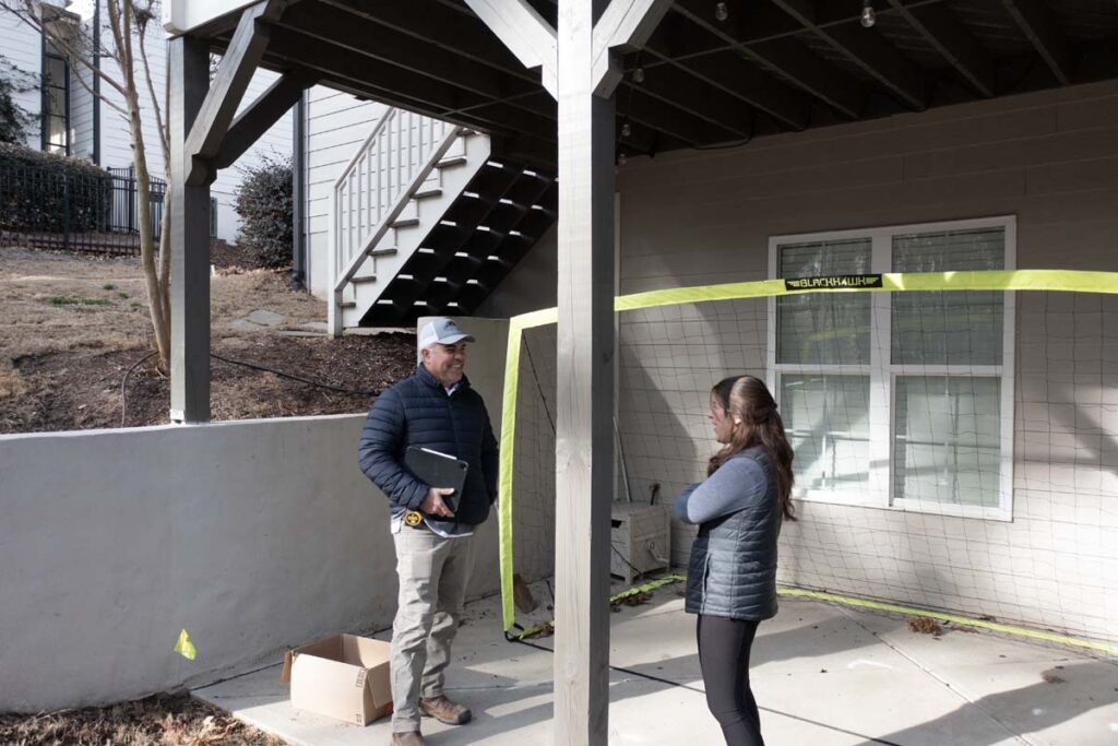 Corner view of Roseroot planning session with Randy Scott and Abbie Tilley, under deck.