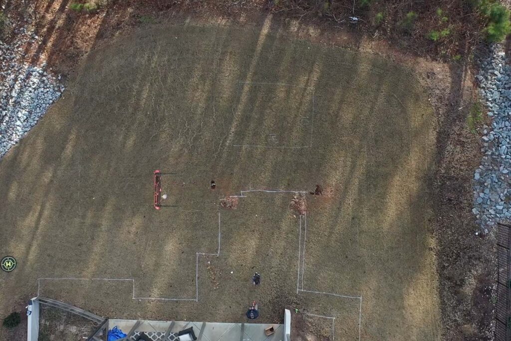 Aerial view showing Roseroot backyard marking patio outline before commencing project.