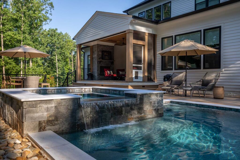 Royal Amber pool featuring waterfall in the foreground and patio deck in the background.