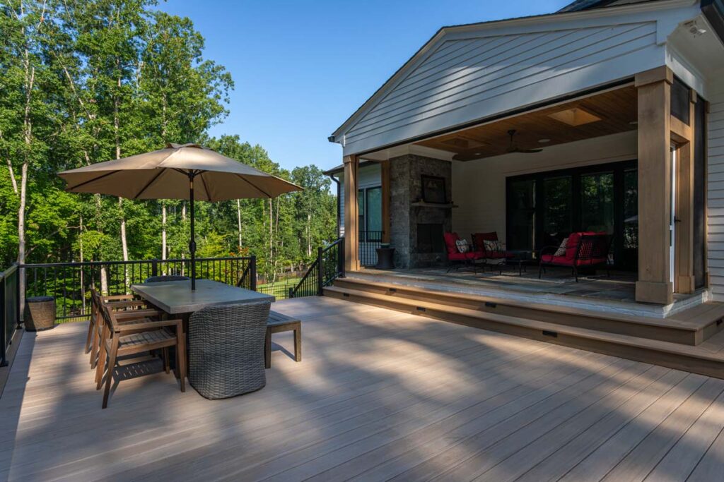 Royal Amber patio deck with elevated deck leading to patio door.