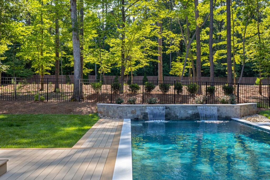 Front view of Royal Amber retain wall also functioning as pool waterfall.