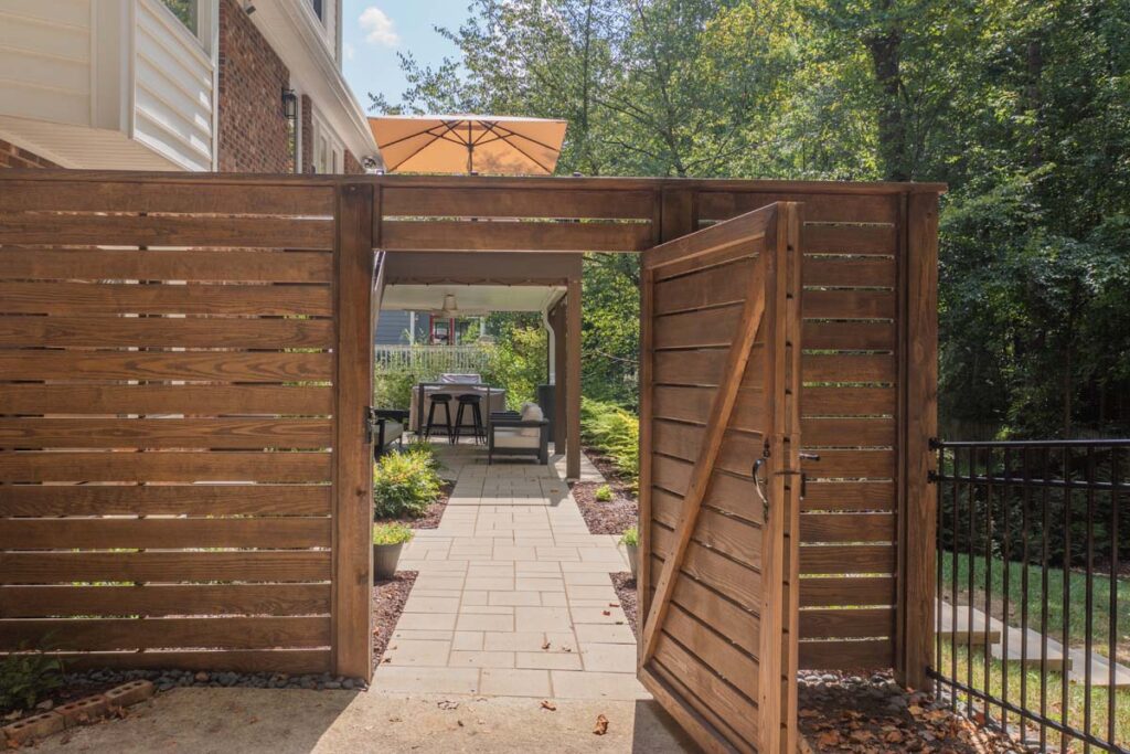 Wide shot of Rushing Brook wooden entrance leading to 2 level deck.