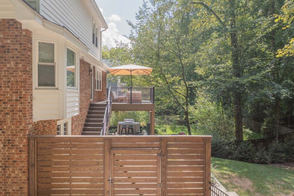 Elevated drone view of Rushing Brook wooden entrance leading to 2 level deck.