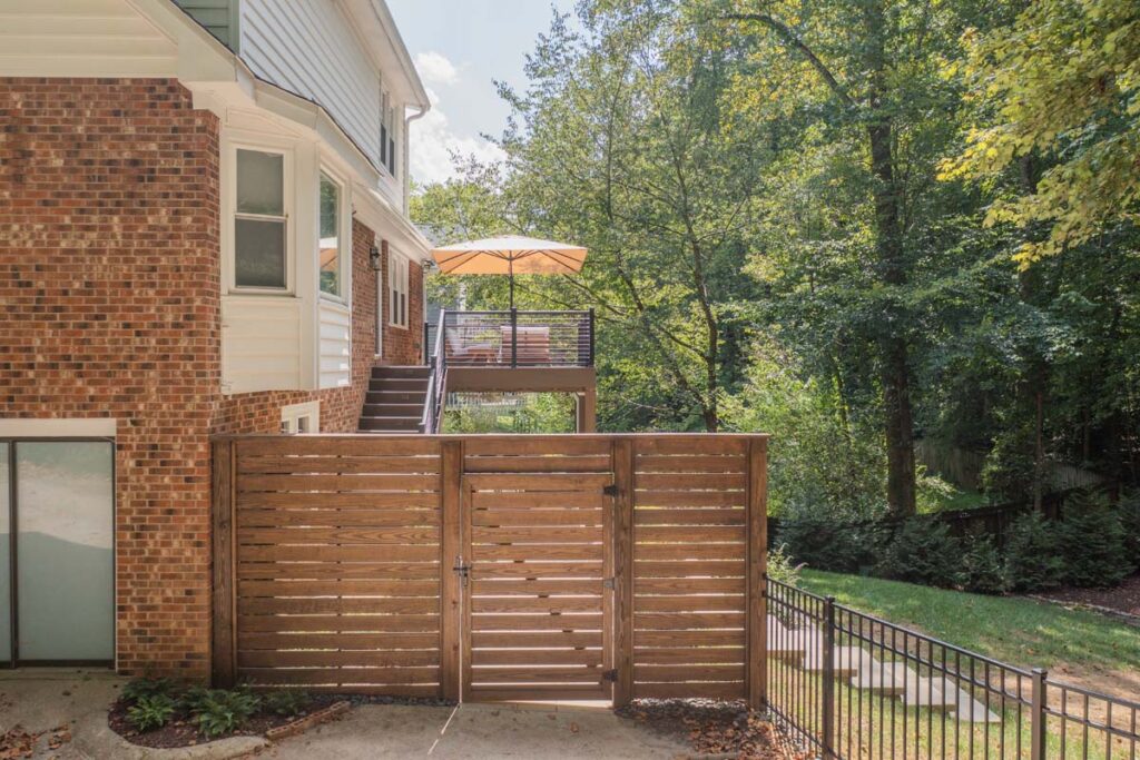 Wide shot of Rushing Brook wooden entrance leading to 2 level deck.