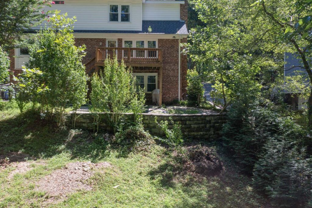 Wide shot of initial retaining wall and wooden deck of Rushing Brook.