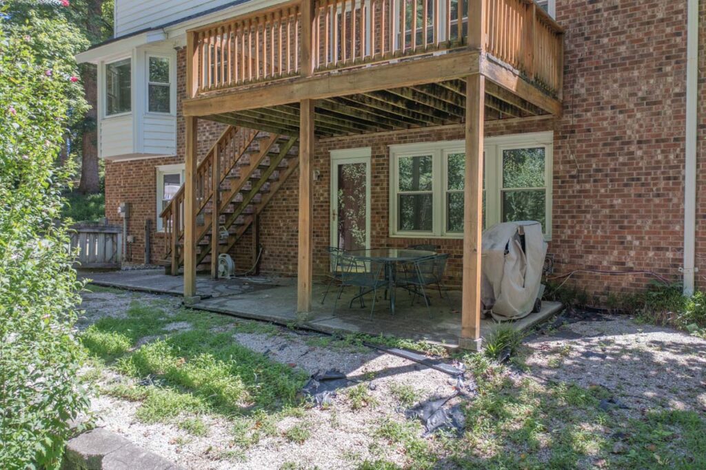 Corner view of initial wooden deck of Rushing brook, covered in green mold.