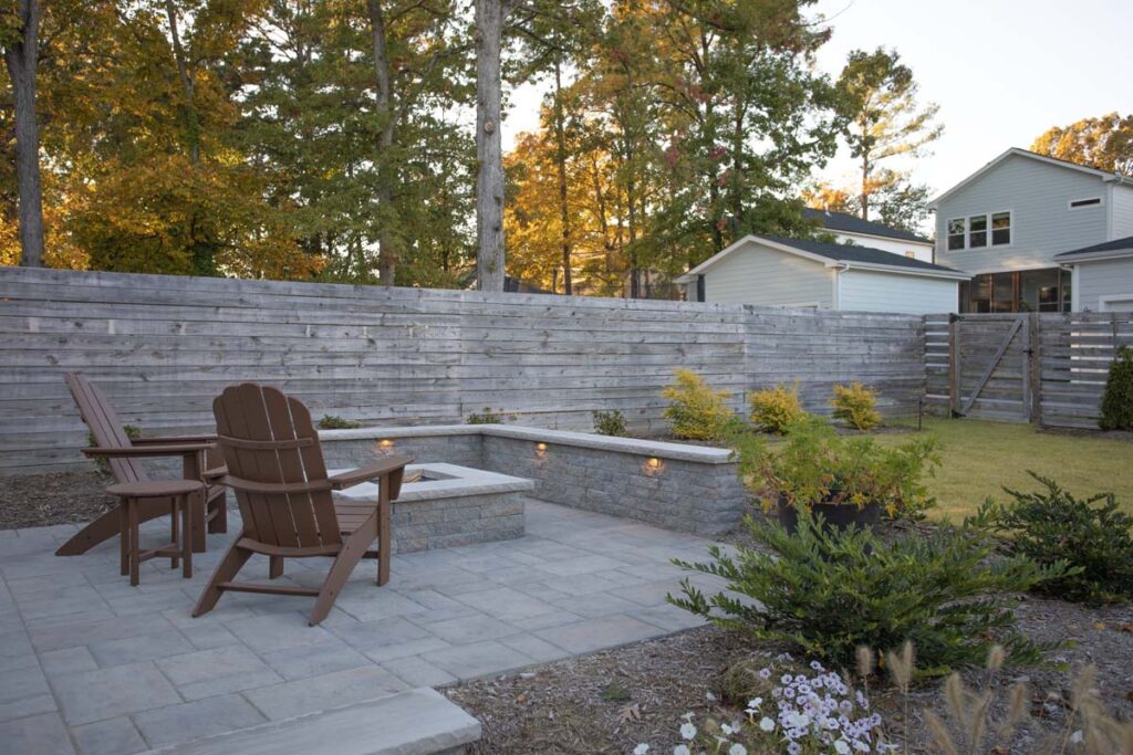 Wide shot of Steven patio project featuring, Techo-bloc pavers and fire pit.