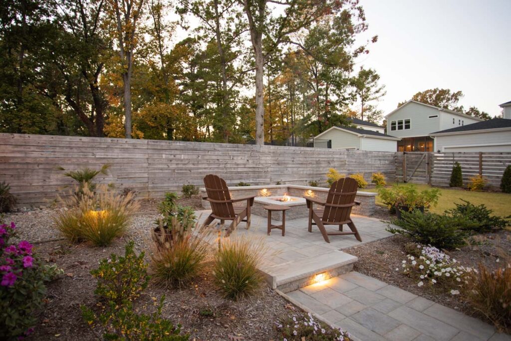 Wide shot of Steven patio project featuring, Techo-bloc pavers and fire pit.