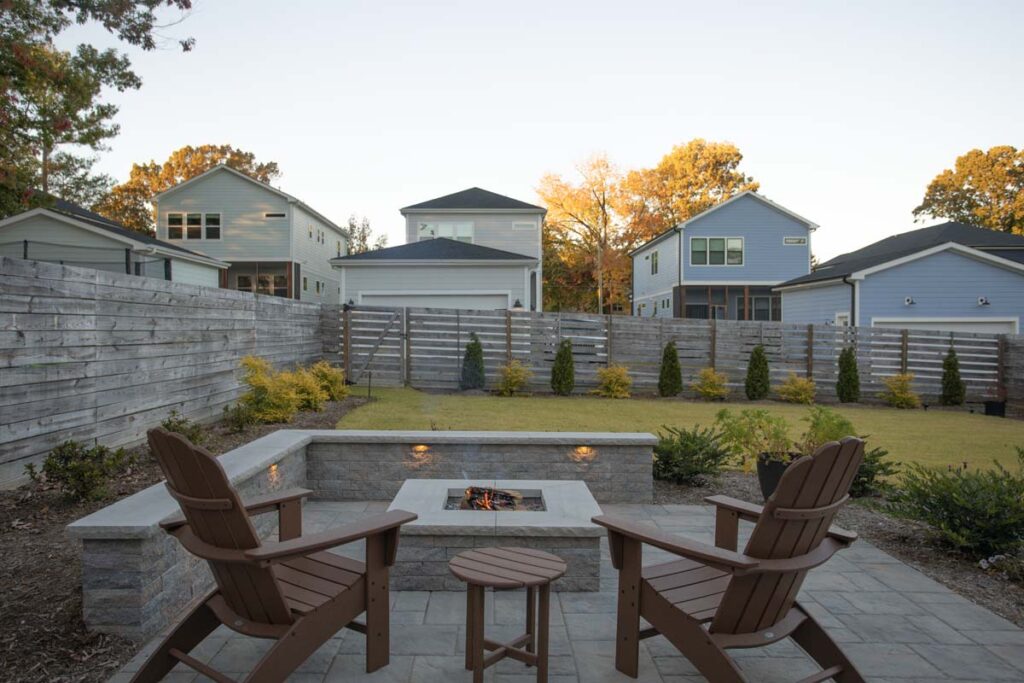 Wide shot of Steven patio project featuring, Techo-bloc pavers and fire pit.