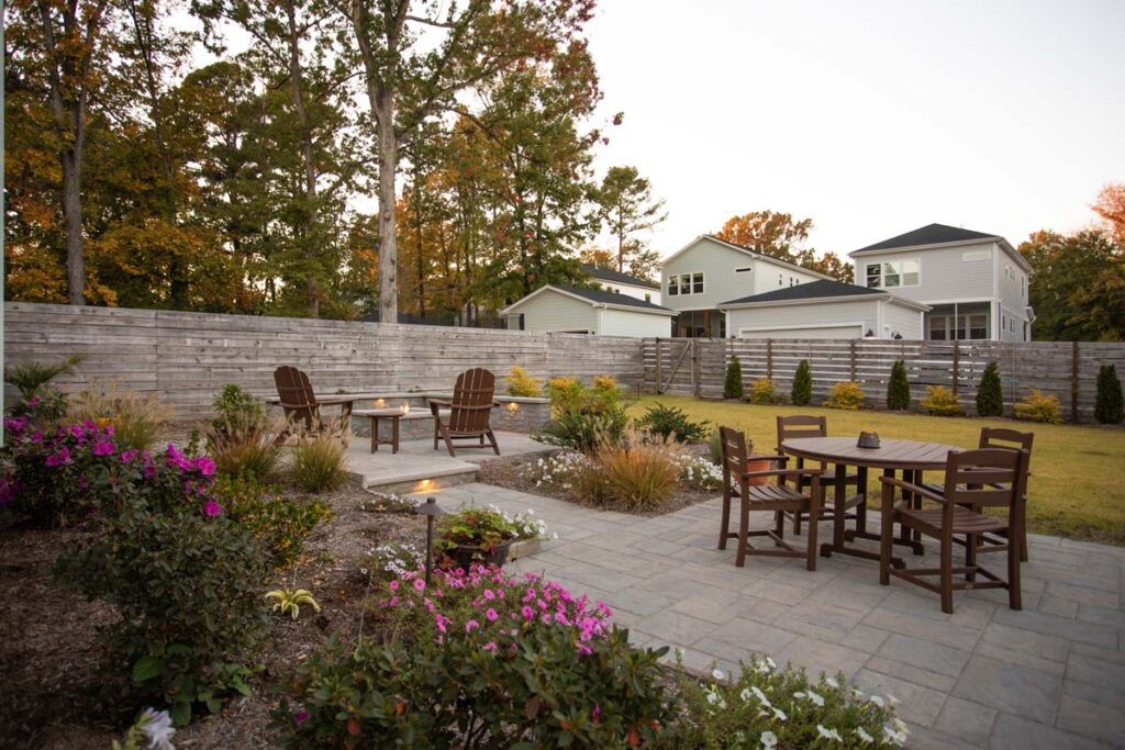 Wide shot of Steven patio project featuring, Techo-bloc pavers and fire pit.