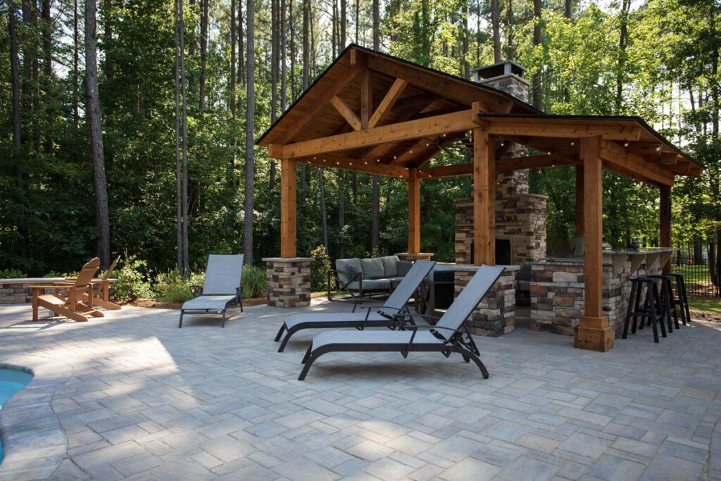 Swann Trail project showing custom built pavilion, with built-in, fireplace, outdoor kitchen and grill.