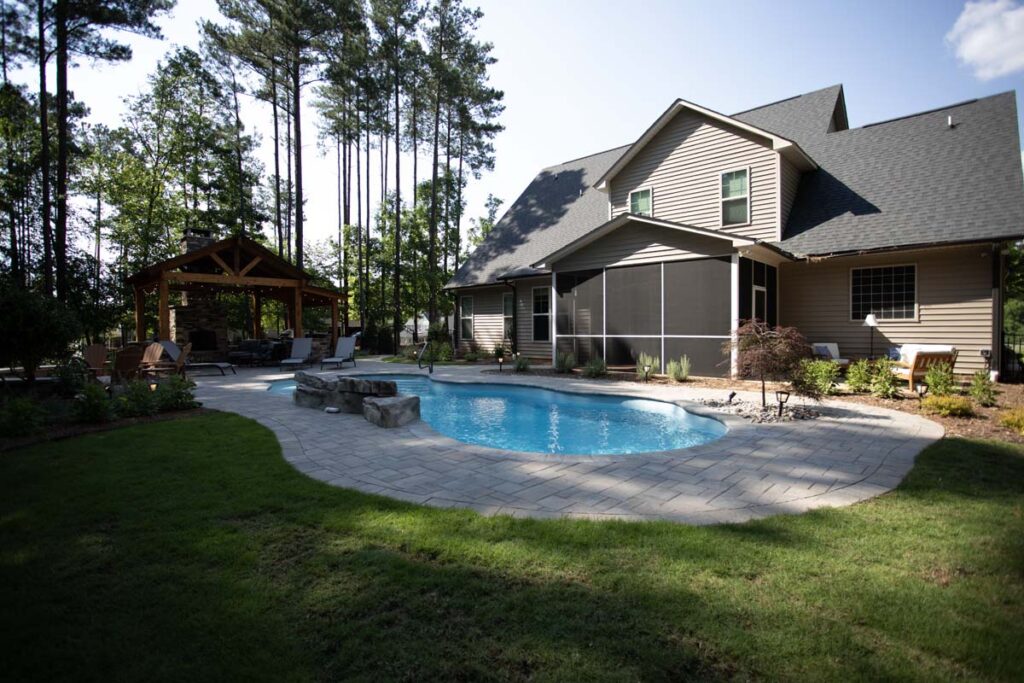 Wide shot of Swann Trail project featuring custom-built pavilion, firepit, and pool.