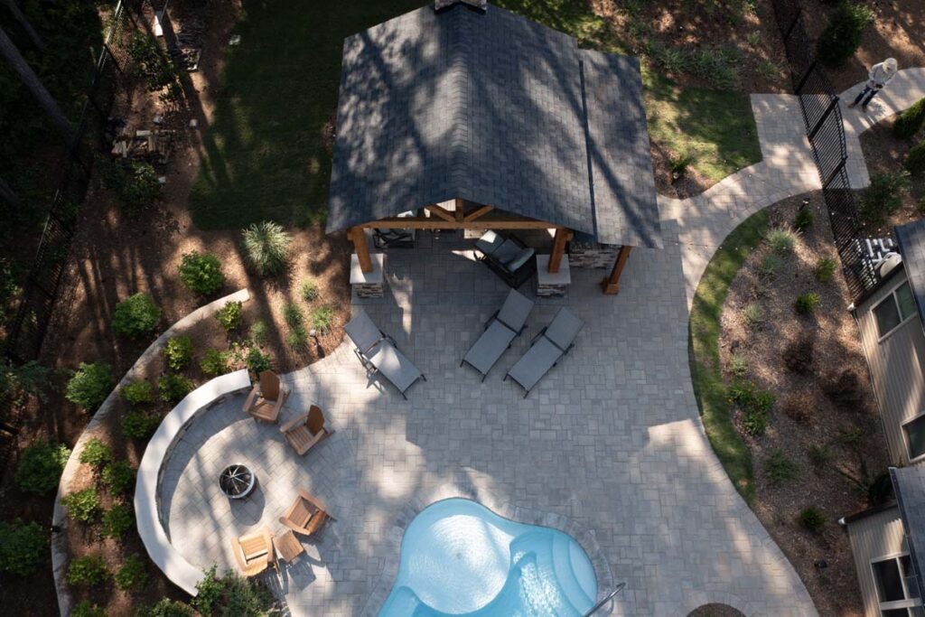 Top view Swann Trail project featuring custom-built pavilion, firepit, retaining wall, and pool.