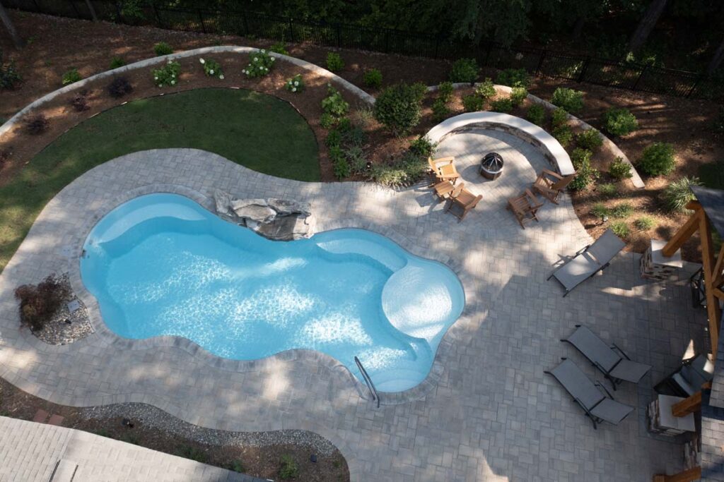 Top view Swann Trail project featuring custom-built pavilion, firepit, retaining wall, and pool.