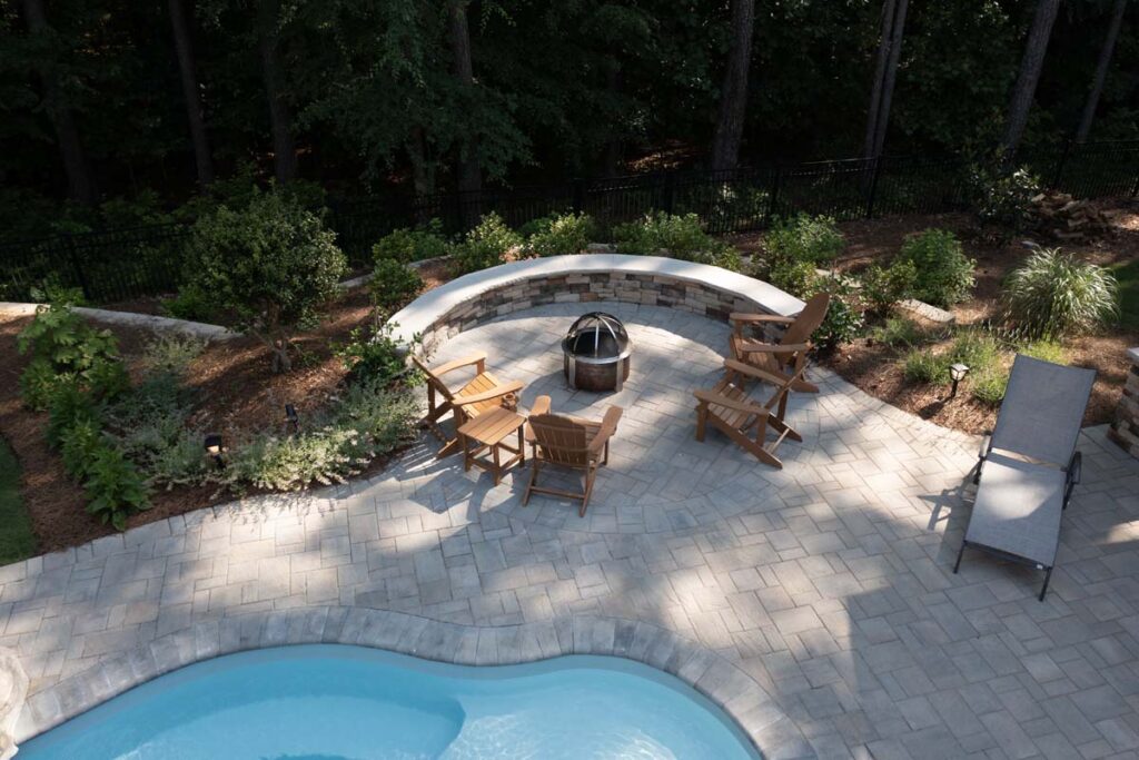 Top view Swann Trail project featuring custom-built firepit, retaining wall, and pool.