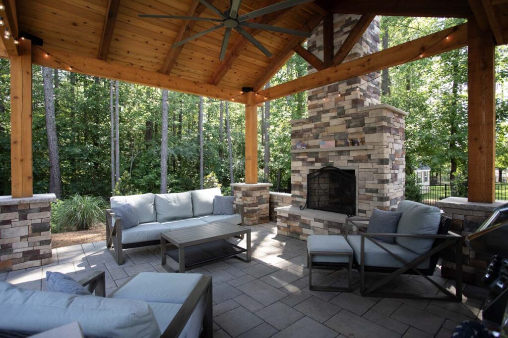 Interior view of Swann Trail project showing custom built pavilion, with built-in, fireplace, and seating area.