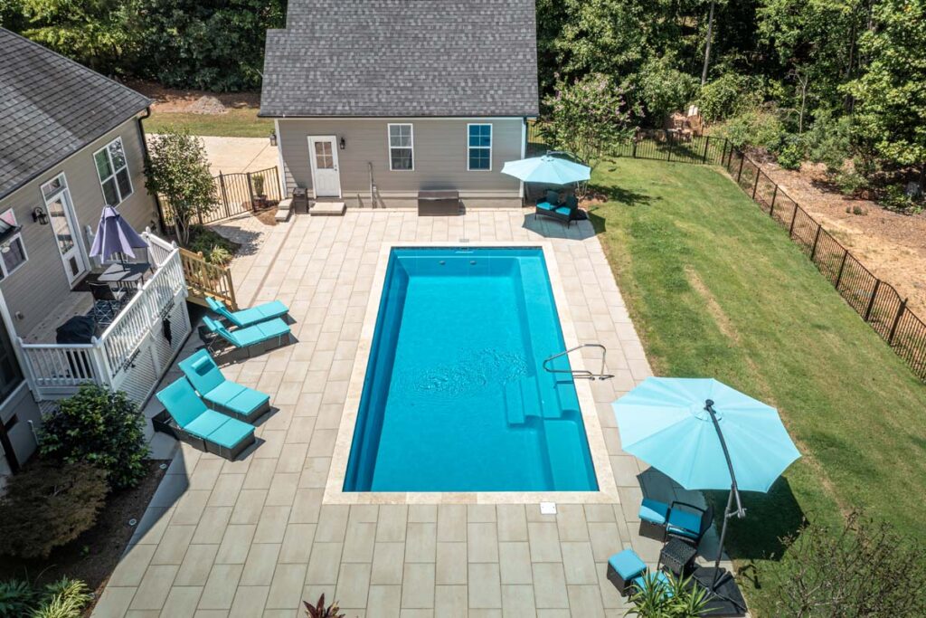 Aerial view Vision project showing pool and deck, featuring Techo-Bloc patio pavers.