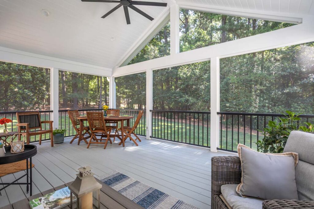 Corner view wide shot of Lowery deck from interior showcasing property's backyard.