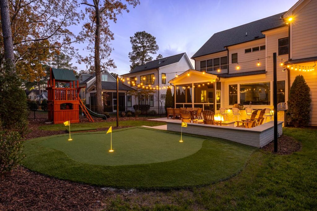 Wide shot showing Skybrook Oak patio and golf area.