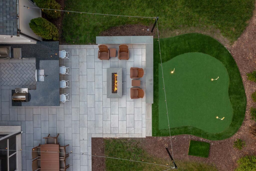 Top aerial view of Skybrook Oak hover over fire pit showing outdoor kitchen.